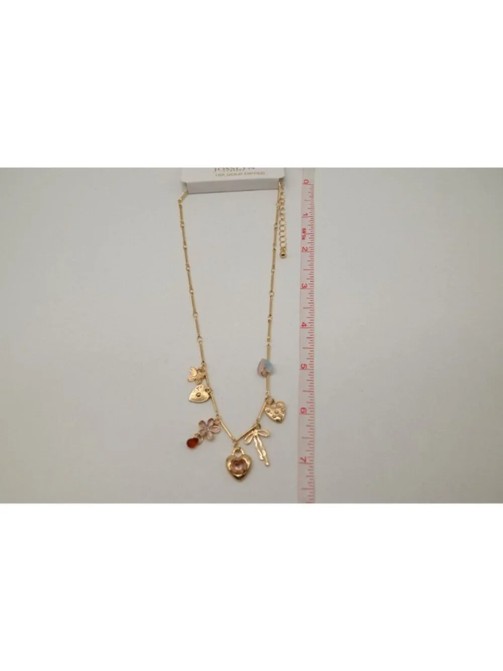 NWT Josslyn Gold Tone Multi Charm Necklace Heart Flower Bow Pendant Feminine